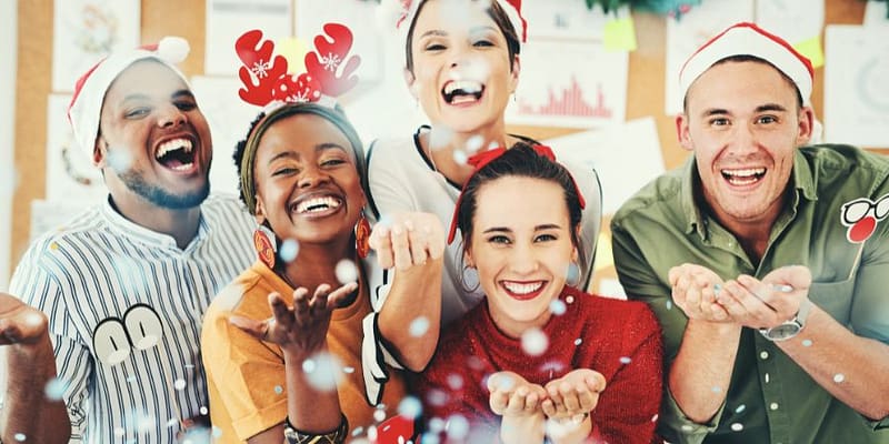 Friends wearing Christmas hats and having fun