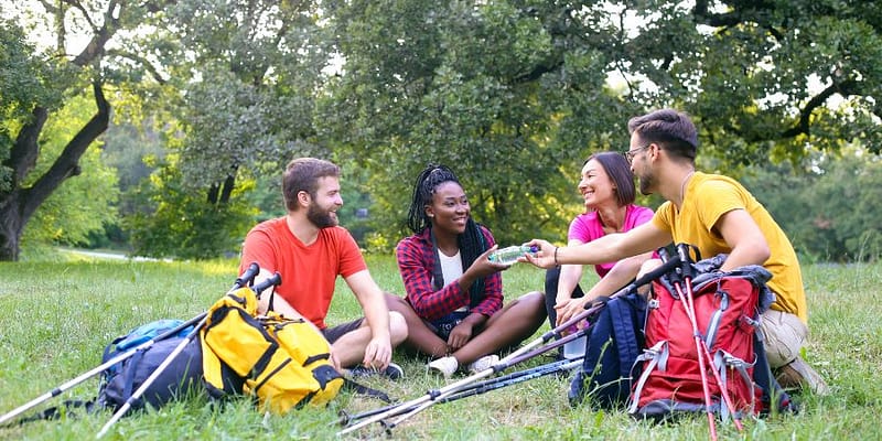 Friends on a hiking trail taking a break